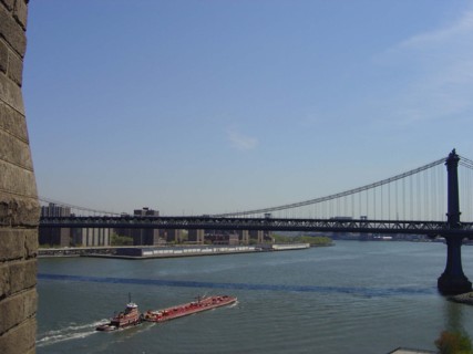 View of Manhattan bridge and the East River from Brooklyn bridge in New York