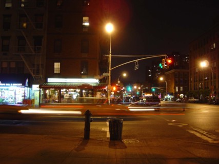 Intersection of a street and an avenue at night in Chelsea, New York