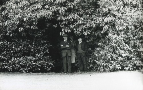Men sheltering from rain, Herbert Park, Dublin