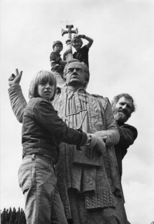 Funeral spectators standing on a statue in Glasnevin cemetery. Dublin, Ireland.
1975