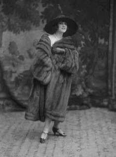 Model wearing a fur coat, c.1920