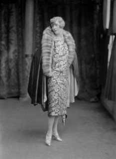 Female model wearing a dress designed by Worth