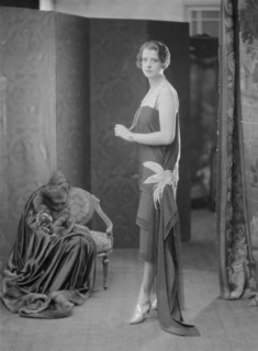 Female model wearing a dress designed by Worth