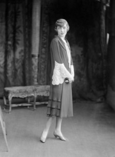 Female model wearing a dress designed by Worth