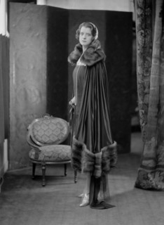 Female model wearing a dress designed by Worth