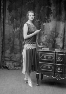 Female model wearing a dress designed by Worth