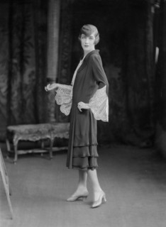Female model wearing a dress designed by Worth