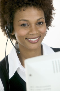 Woman wearing telephone headset.