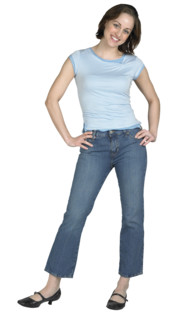 A woman standing with her hands on her hips.