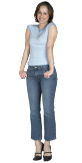 Woman with her thumbs in her pockets.