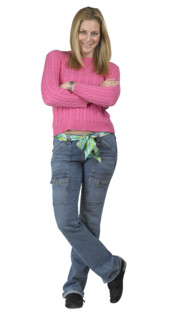A young woman standing with her arms folded.