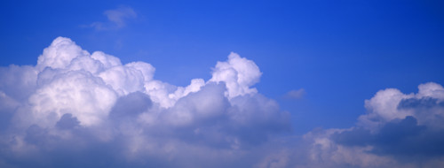 Puffy clouds and blue sky.