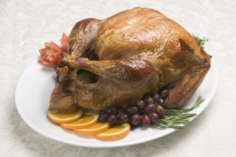 A roast turkey ready for eating.