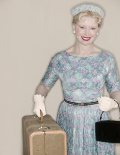 A retro woman leaving on a trip.