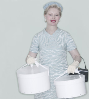 Woman with hat boxes.