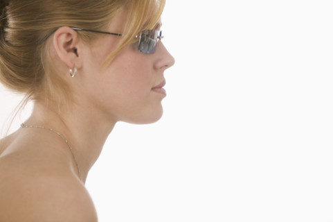 Profile of woman wearing sunglasses.