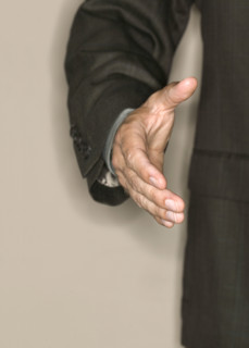 Man reaching out to shake hands.