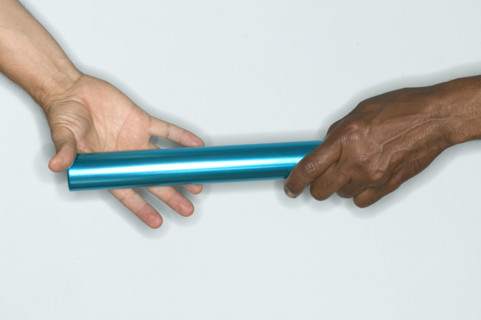 Passing baton from one hand to another.