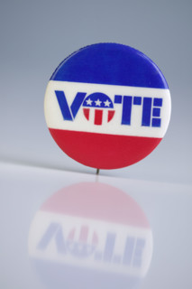 A pin urging people to vote.