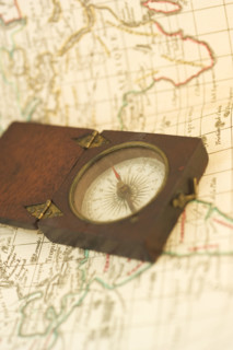 Closeup of a map and compass.
