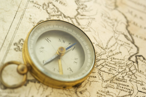 Closeup of a map and compass.