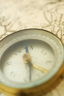 Closeup of a map and compass.