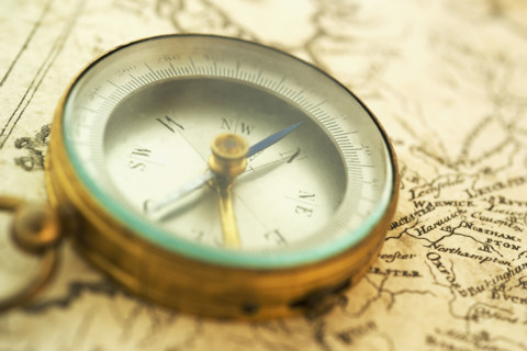 Closeup of a map and compass.