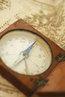 Closeup of a map and compass.
