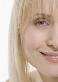 Partial view of smiling woman's face.