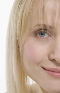 Partial view of smiling woman's face.
