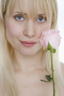 Woman with pink rose.