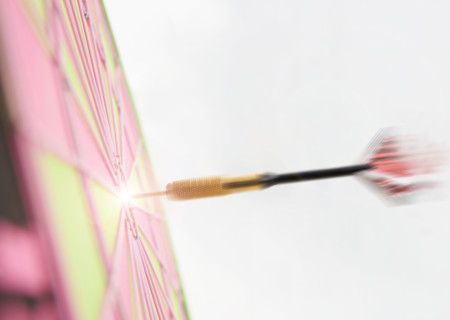Profile of dart hitting bulls eye.