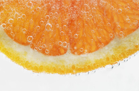 Extreme closeup of citrus fruit slice.