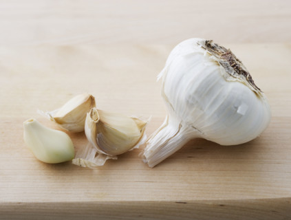 Closeup of garlic head and cloves.
