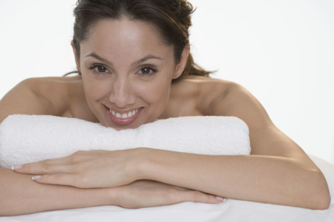 Head and shoulders of smiling woman.