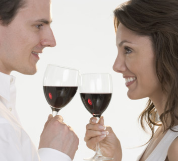 Profile of couple with red wine.