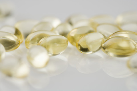 Closeup of several yellow gelcaps.
