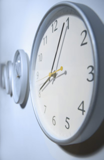 Closeup of clock on wall.
