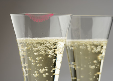 Closeup of champagne with lipstick print.