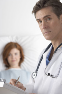 Doctor visiting with patient.