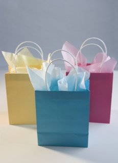 Colorful gift bags with tissue paper.