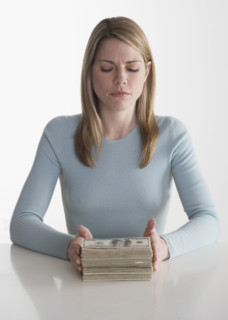 Woman with a stack of money.