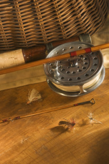 Still life of antique fishing reels.