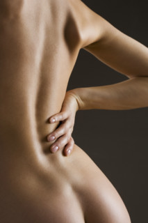 Rear view of a nude female.
