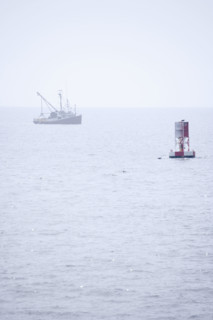 Lobster boat in fog off the Maine coast.