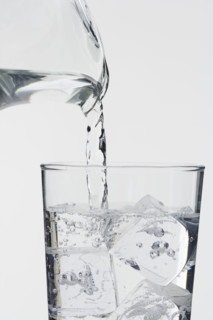 Pouring a glass of ice water.