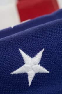 Closeup of star on American flag.