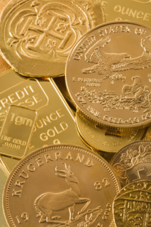 Still life of gold bars and coins.