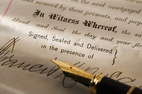 Closeup of pen and contract.