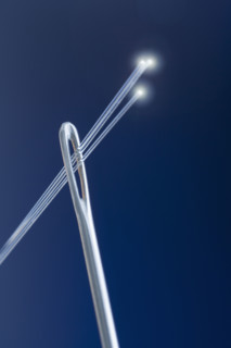 Needle with fiber optic threads.